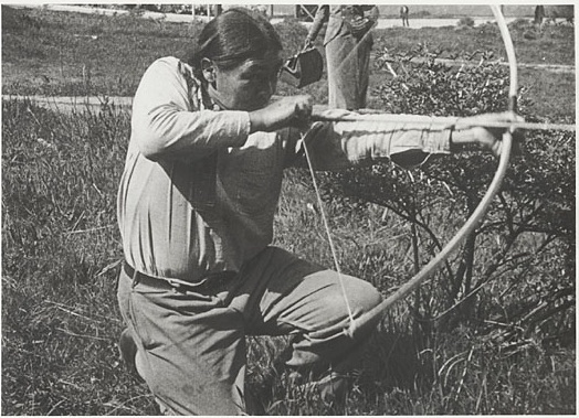 Ishi demonstrating traditional Yahi archery techniques